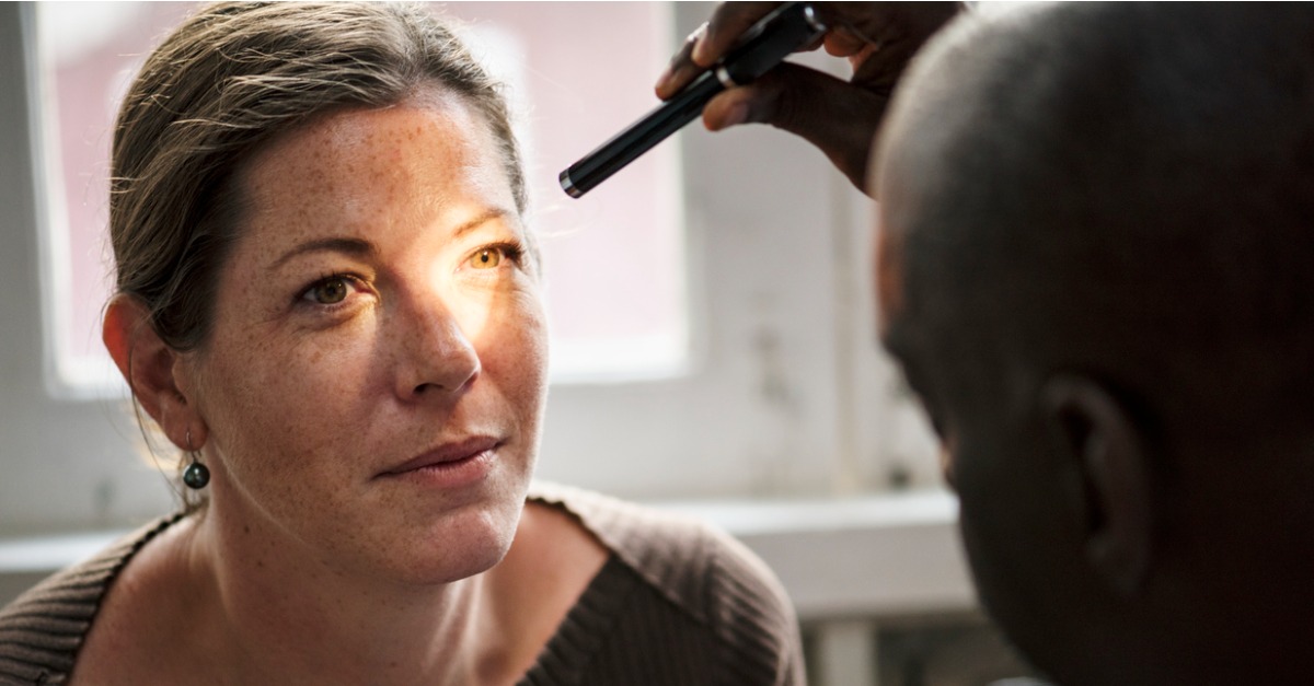 caucasian woman getting eye exam