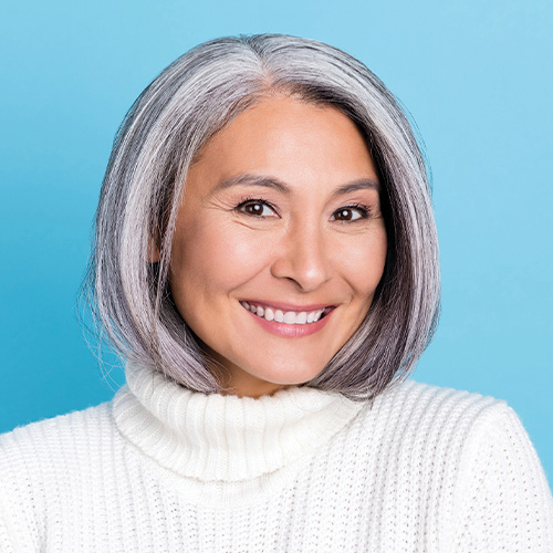 Smiling middle-aged Asian woman who is smiling about her Eye Consultants of Atlanta visit.