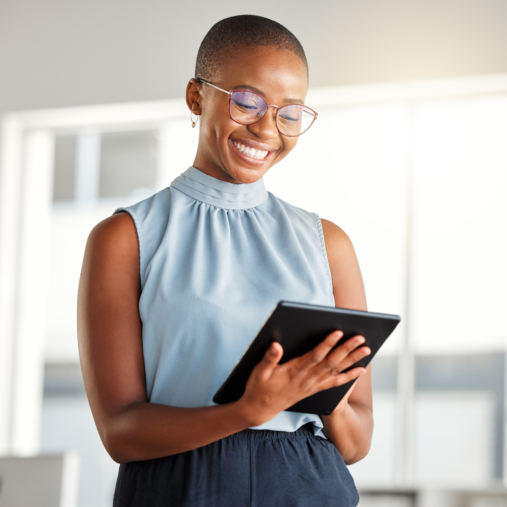 Cheerful businesswoman with tablet 