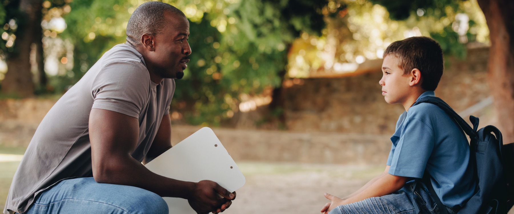 School teacher motivating young student