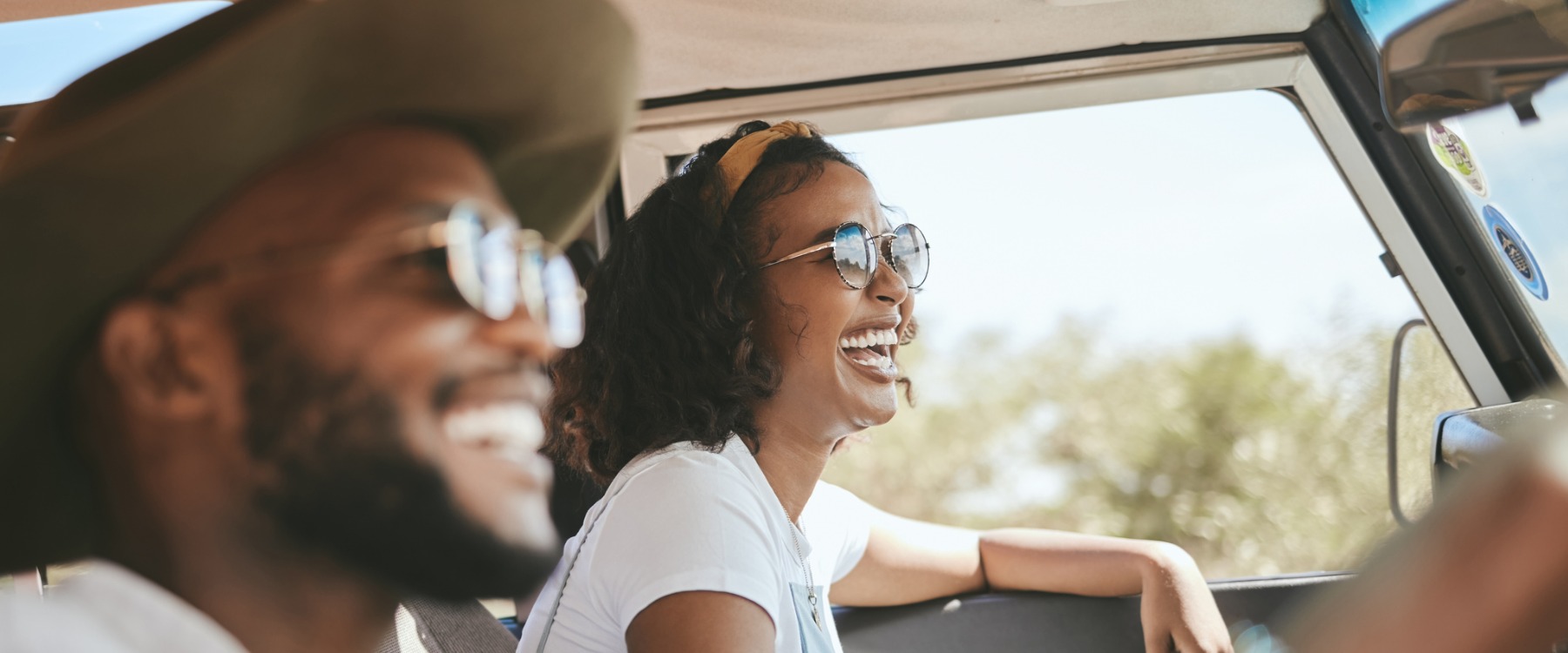 Happy African couple in car